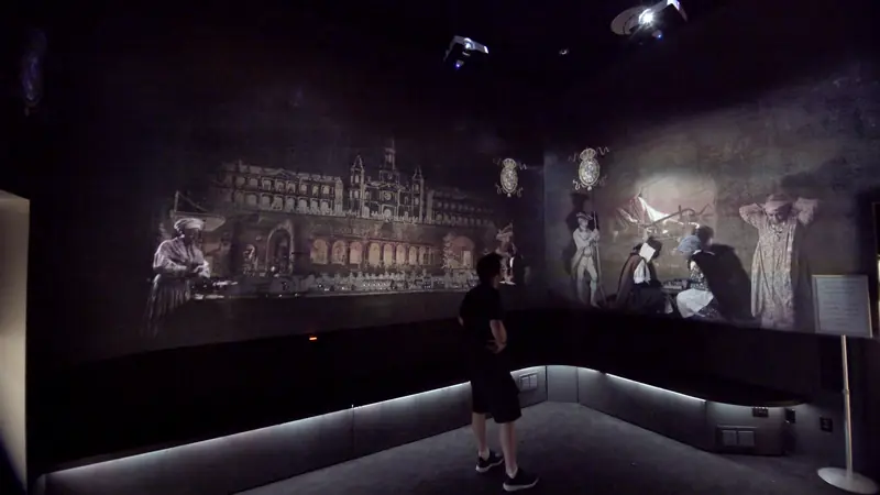 Visitors inside the French Quarter by Night projection room