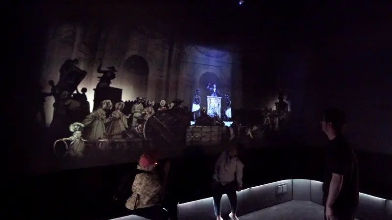 Visitors inside the French Quarter by Night projection room